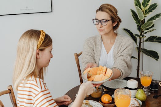 image of a person taking supplements with a healthy meal