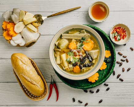 A colorful bowl of lentil soup with greens