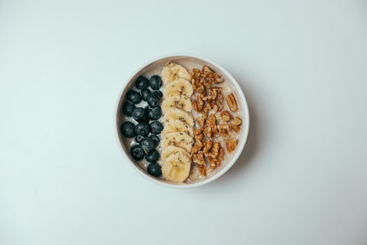 a bowl of oatmeal topped with bananas and almonds